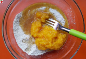 Adding pumpkin puree to the flour